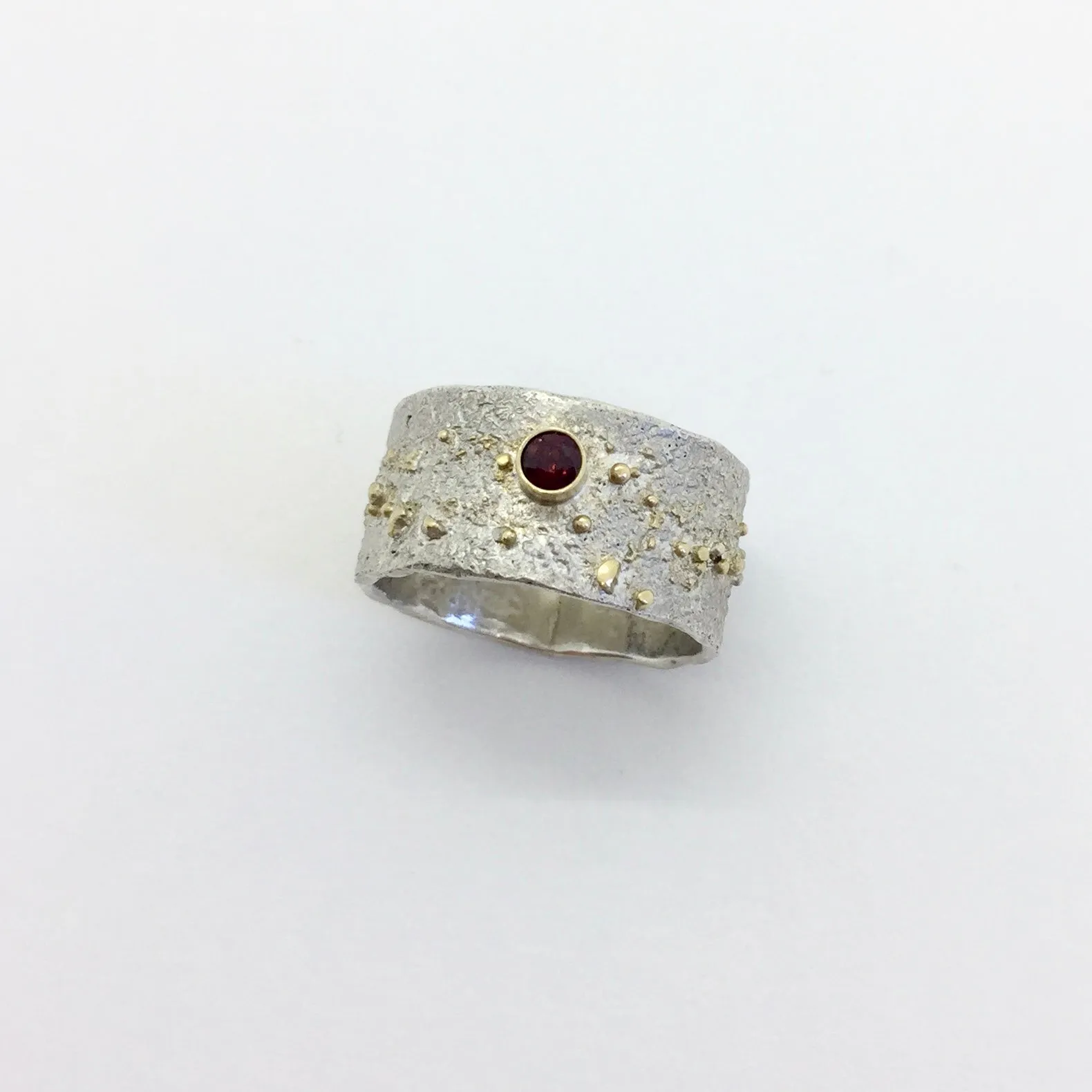 Reticulated Silver Ring with 18k gold powder fused and 3mm round Garnet set in 18k gold bezel